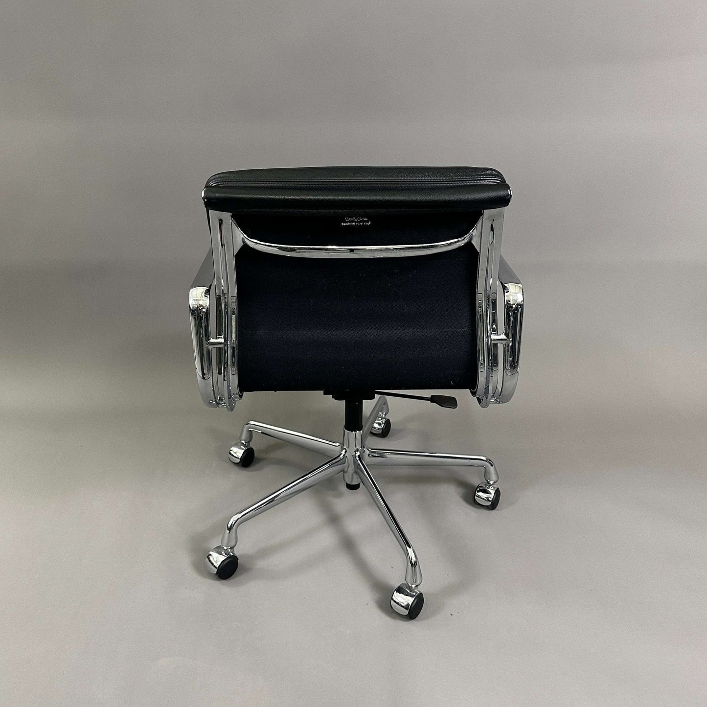 Vitra EA 217 black leather office chair with chrome frame viewed from the back