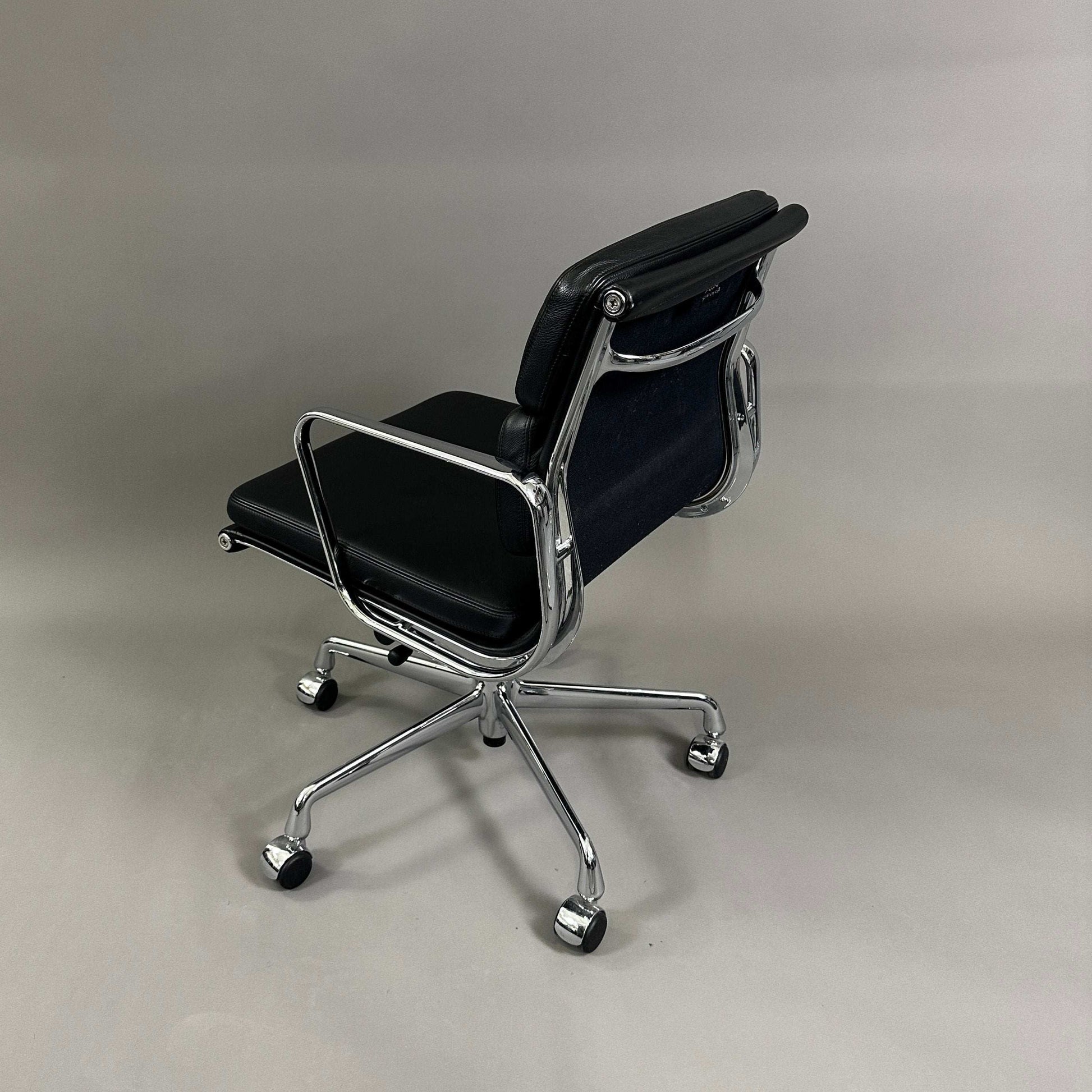 Vitra EA 217 black leather office chair with chrome frame and swivel base