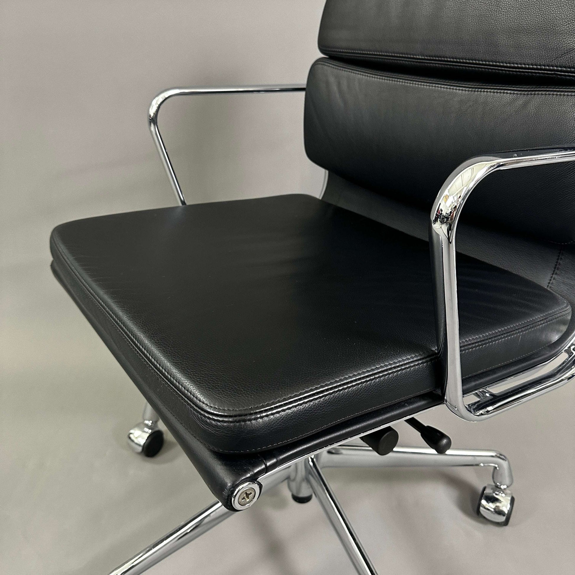 Vitra EA 217 black leather office chair with chrome frame and adjustable swivel base