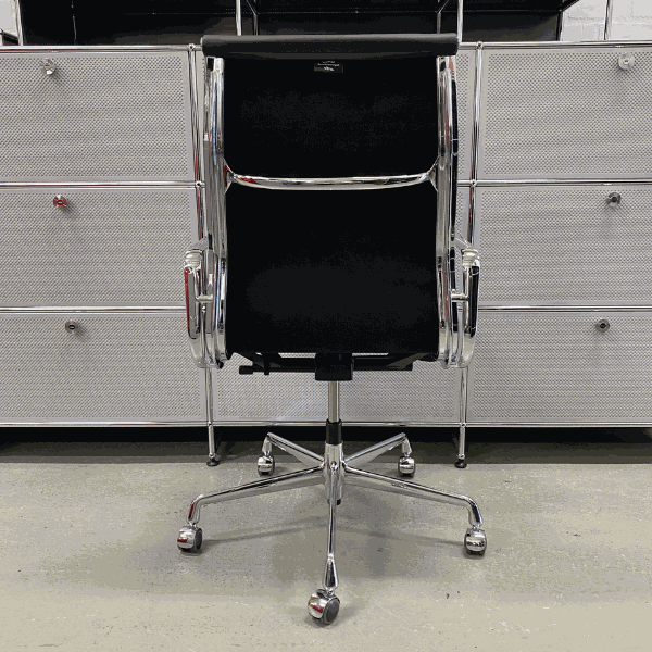 Vitra EA 219 black leather office chair with chrome frame and adjustable reclining mechanism viewed from the back
