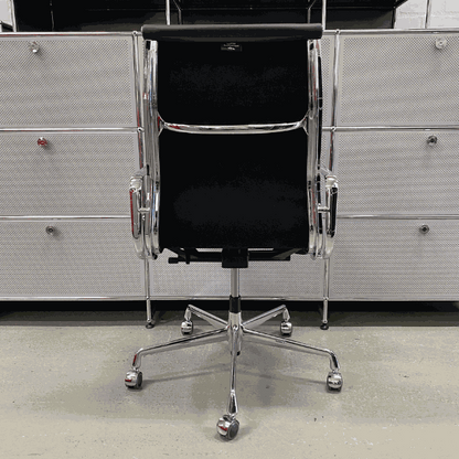 Vitra EA 219 black leather office chair with chrome frame and adjustable reclining mechanism viewed from the back