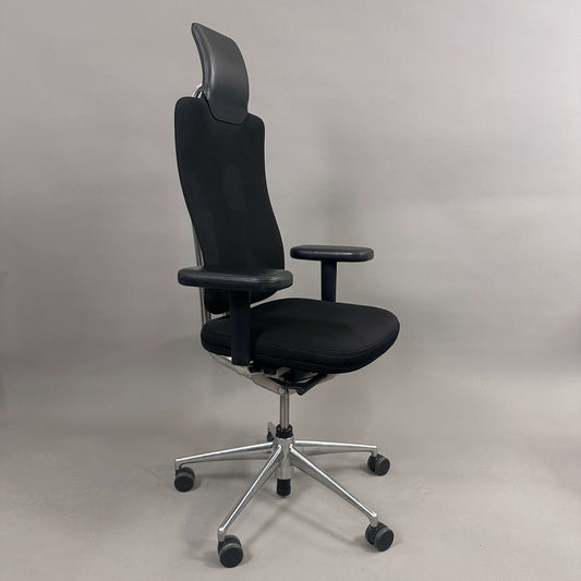 Vitra Headline black office chair with fabric seat, leather headrest, adjustable armrests, and chrome base