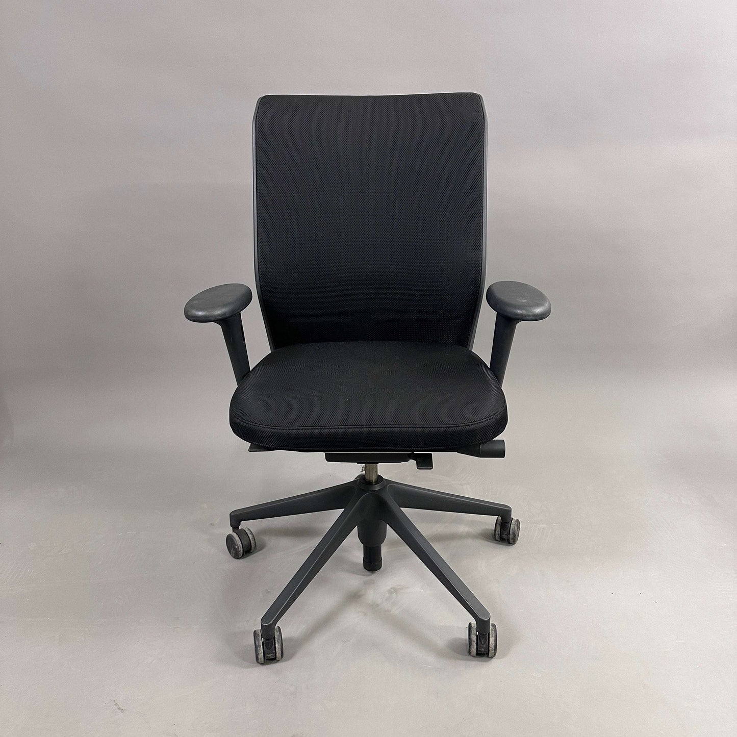 Vitra ID Mesh black ergonomic office chair with adjustable armrests and lumbar support