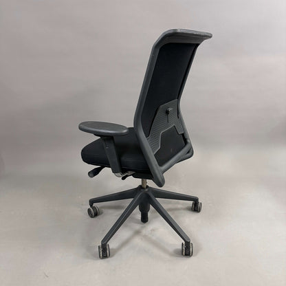 Black Vitra ID Mesh ergonomic office chair with adjustable seat height, depth, lumbar support, 3D armrests, and locking backrest