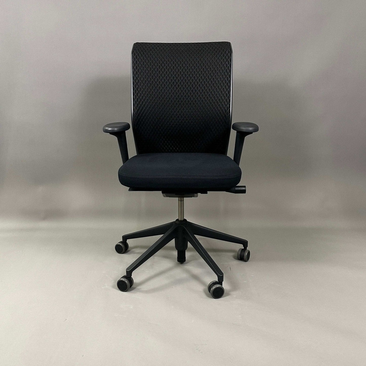 Vitra ID Mesh ergonomic black office chair with adjustable armrests, lumbar support, and breathable diamond mesh backrest