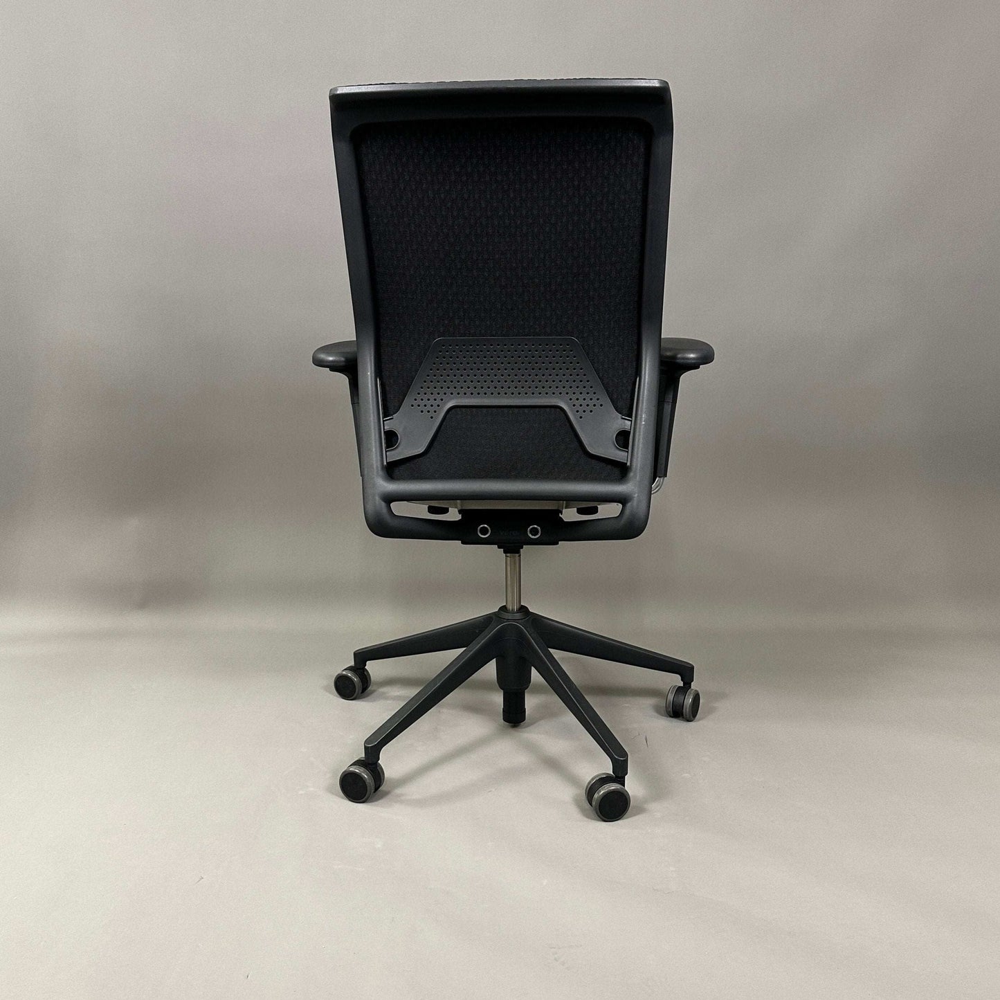 Black Vitra ID Mesh office chair with adjustable features and breathable diamond mesh backrest.