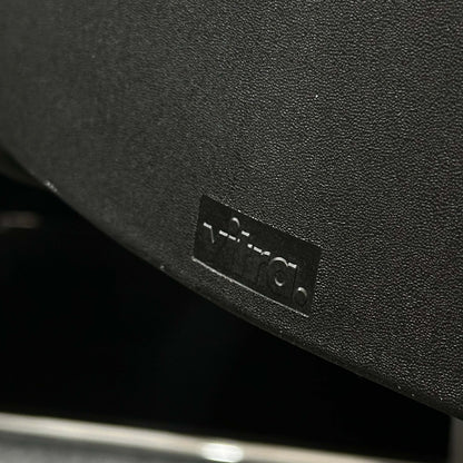 Close-up of the black Vitra ID Soft office chair with fabric cover and black plastic base highlighting ergonomic design.