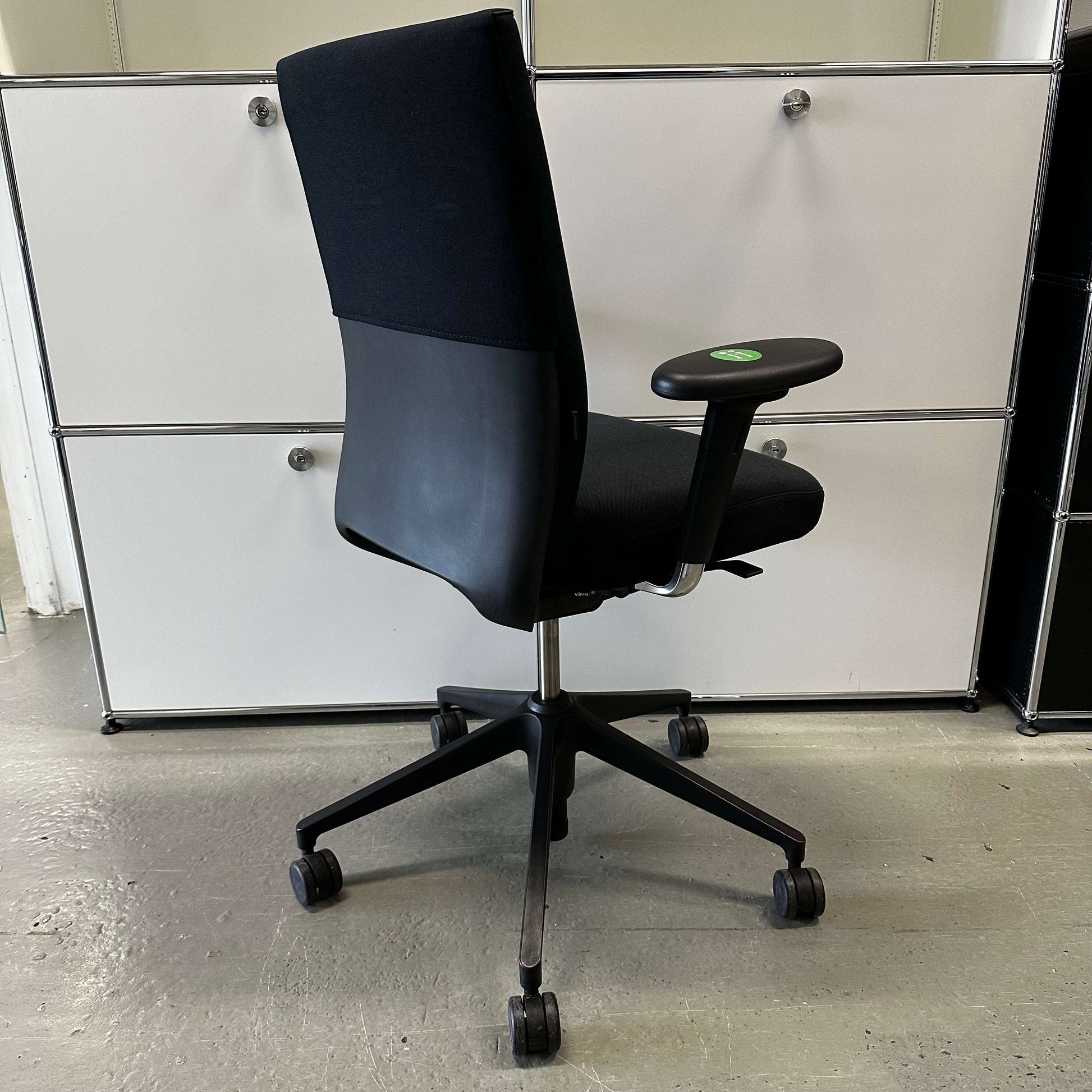 Vitra ID Soft black office chair with ergonomic design, fabric seat, and black plastic base