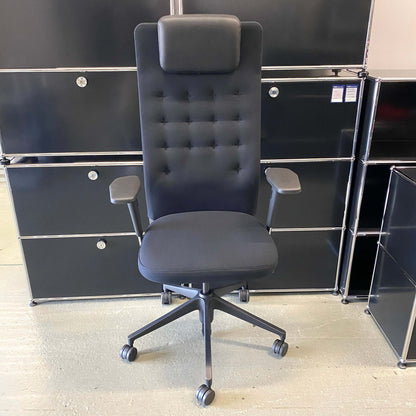 Black Vitra ID Trim L office chair with adjustable headrest, armrests, lumbar support and fabric seat upholstery.
