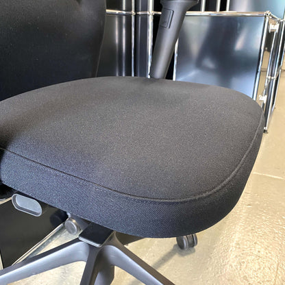 Vitra ID Trim L ergonomic black office chair with adjustable seat and armrests, fabric seat and leather headrest