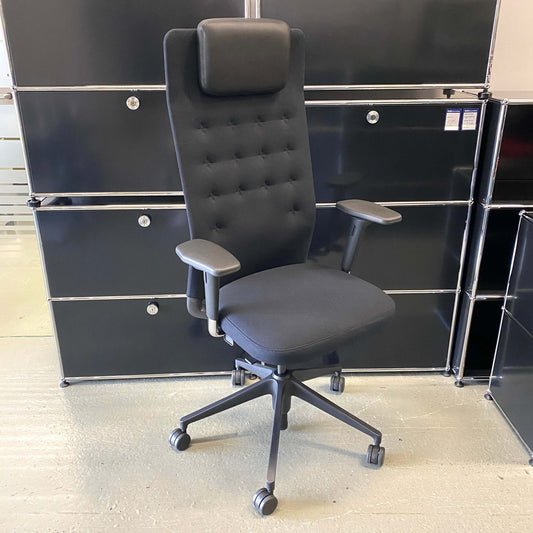 Vitra ID Trim L black ergonomic office chair with adjustable armrests, lumbar support, and leather headrest