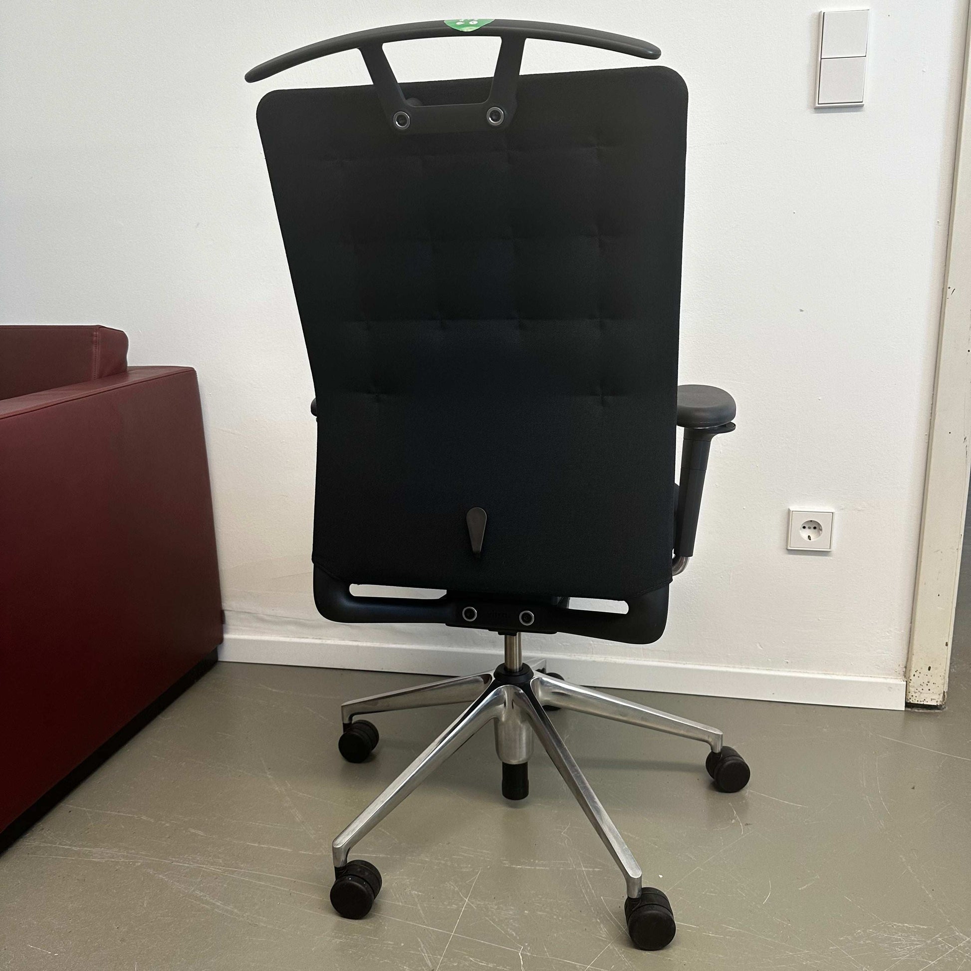 Black Vitra ID Trim ergonomic office chair with adjustable features and lumbar support viewed from the back