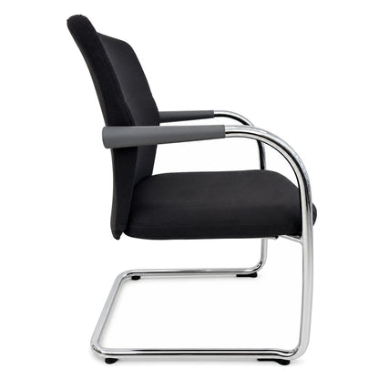 Vitra ID Visitor Soft Freischwinger in Dunkelgrau mit verchromtem Gestell und Armlehnen in Seitenansicht.