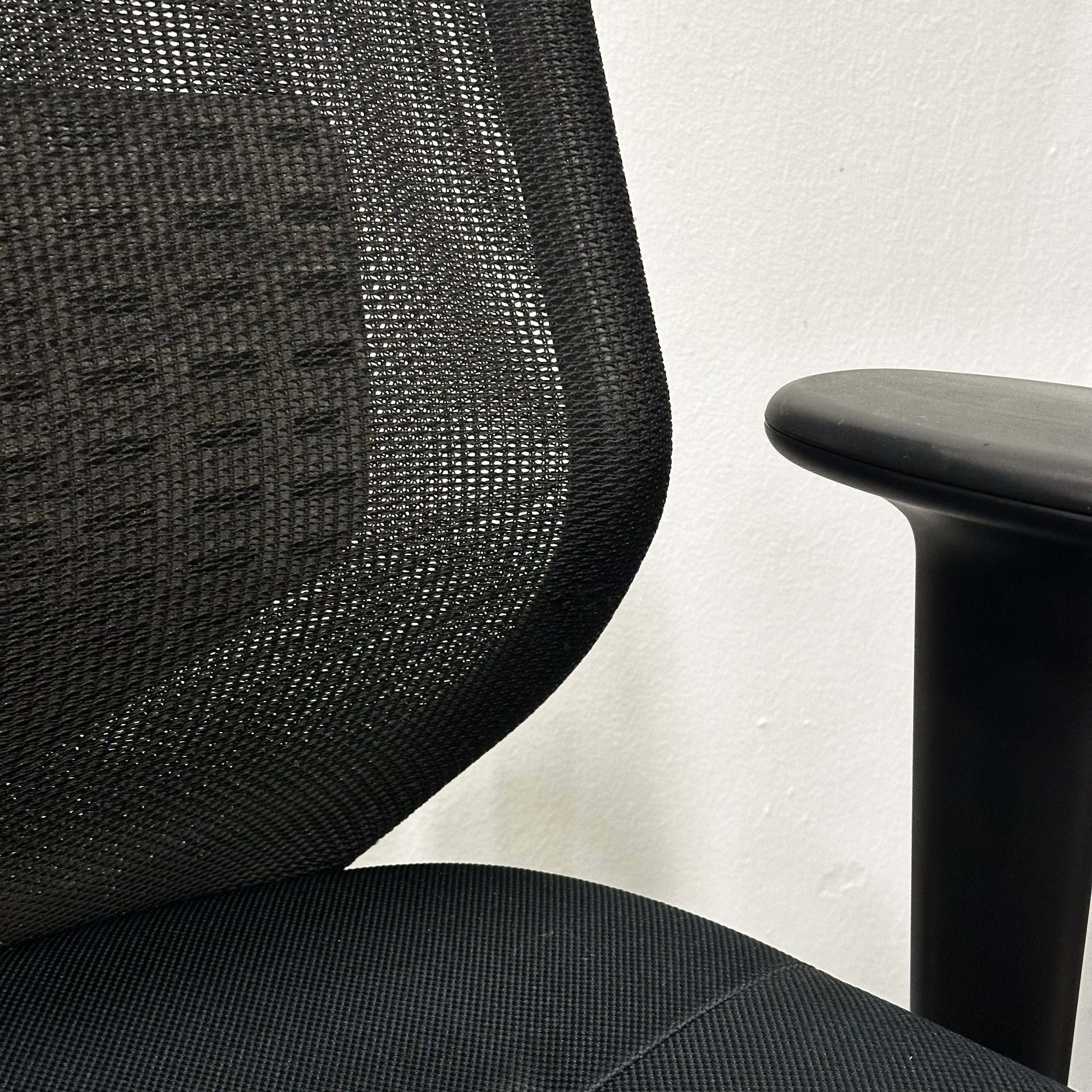 Vitra Meda Pro black office chair with adjustable seat height, lumbar support, and breathable double-layer mesh backrest