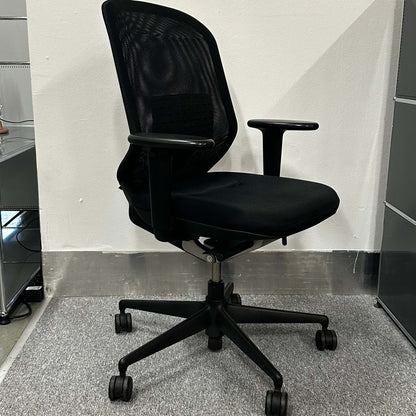 Vitra Meda Pro black ergonomic office chair with adjustable seat height, lumbar support, and breathable double-layer mesh backrest