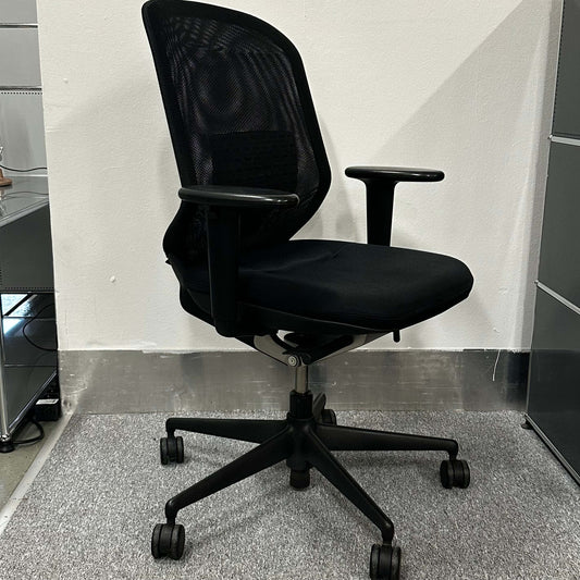 Vitra Meda Pro black ergonomic office chair with adjustable seat height, lumbar support, and breathable double-layer mesh backrest