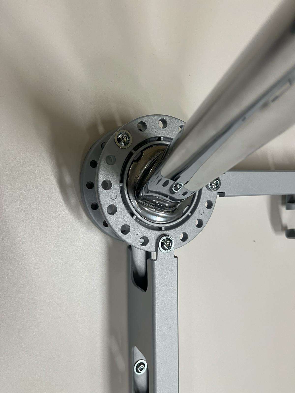 Close-up of the metal joint and frame structure of the Vitra Medamorph meeting table leg