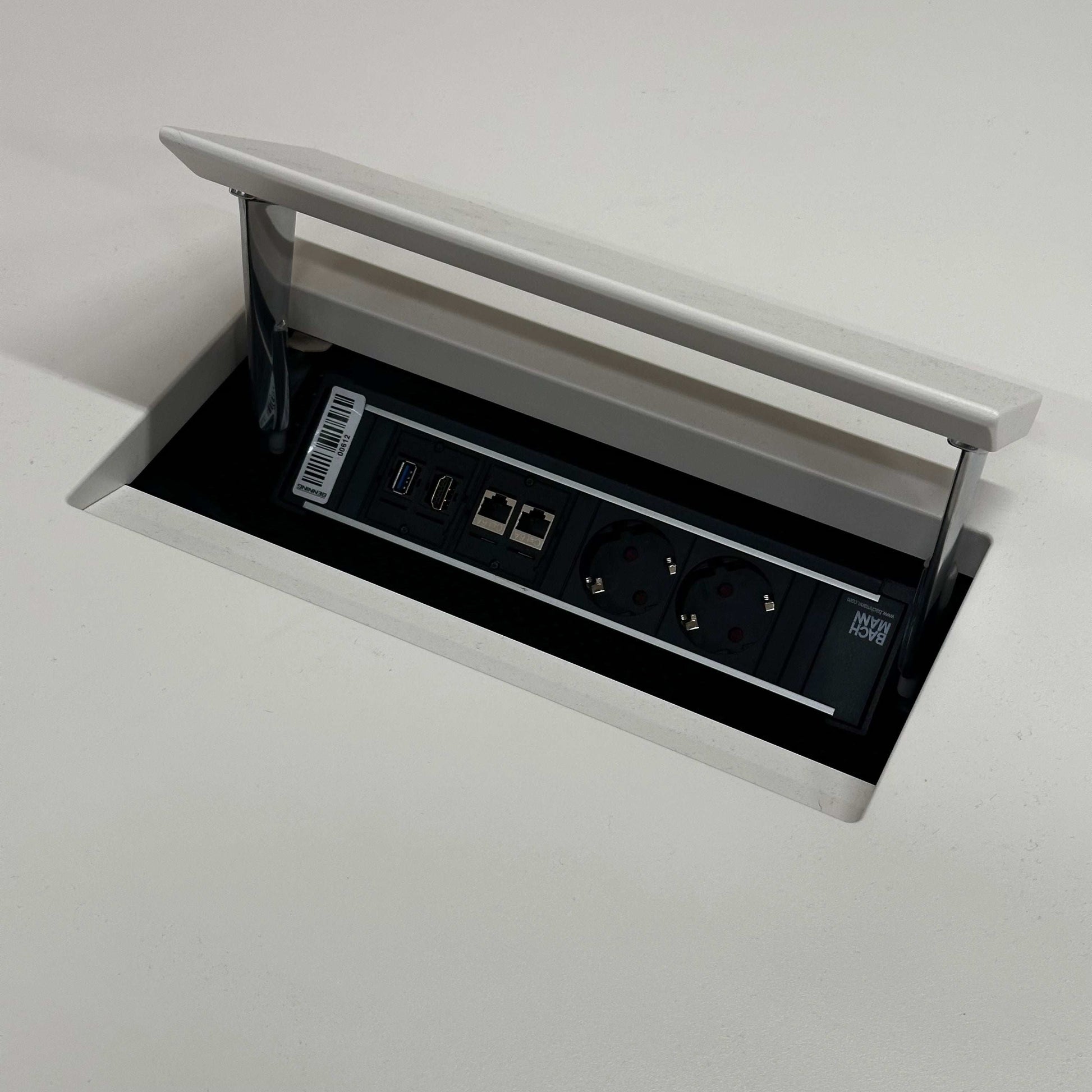 Vitra Medamorph meeting table with built-in power and USB ports in white surface