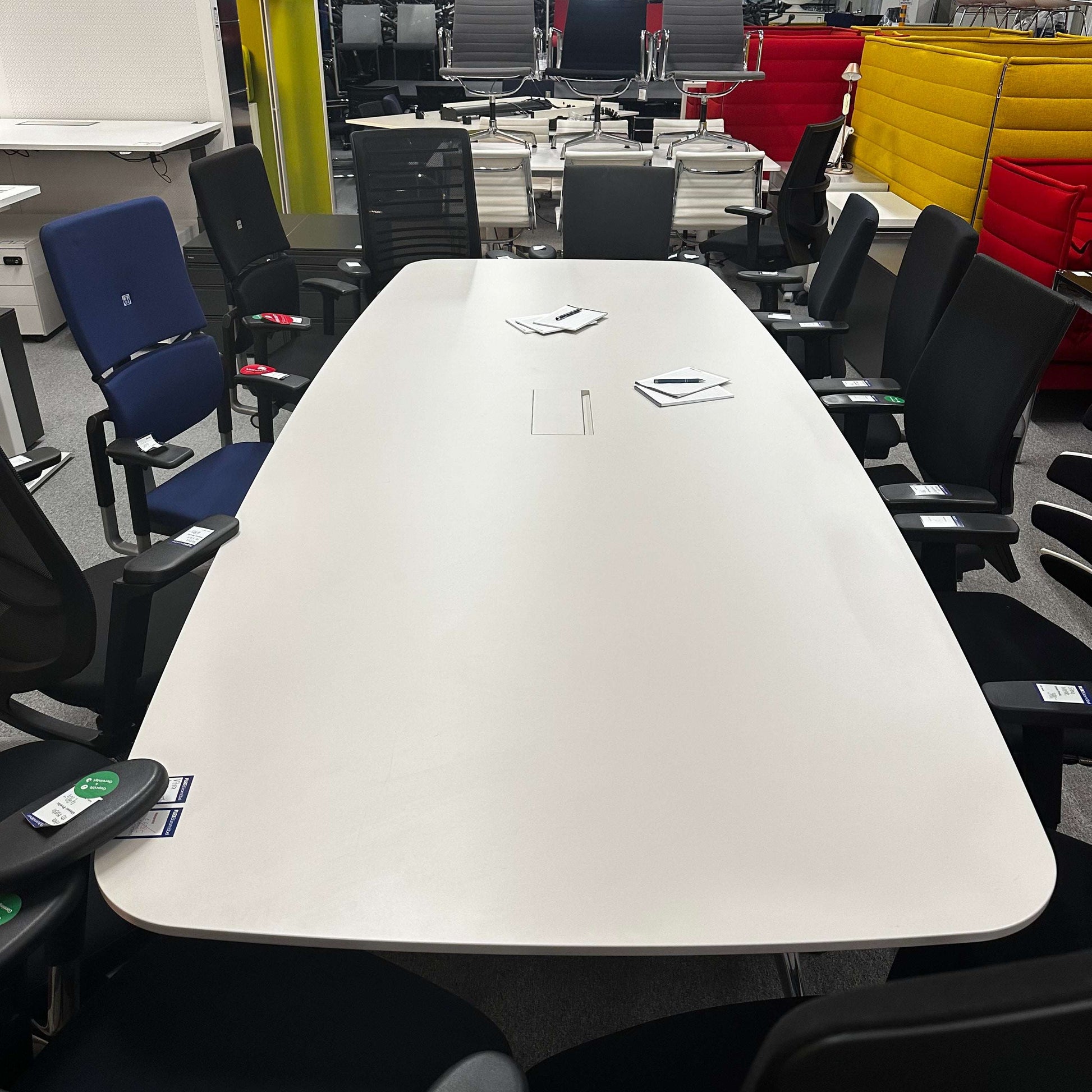 Vitra Medamorph large modern white conference table surrounded by office chairs in meeting room