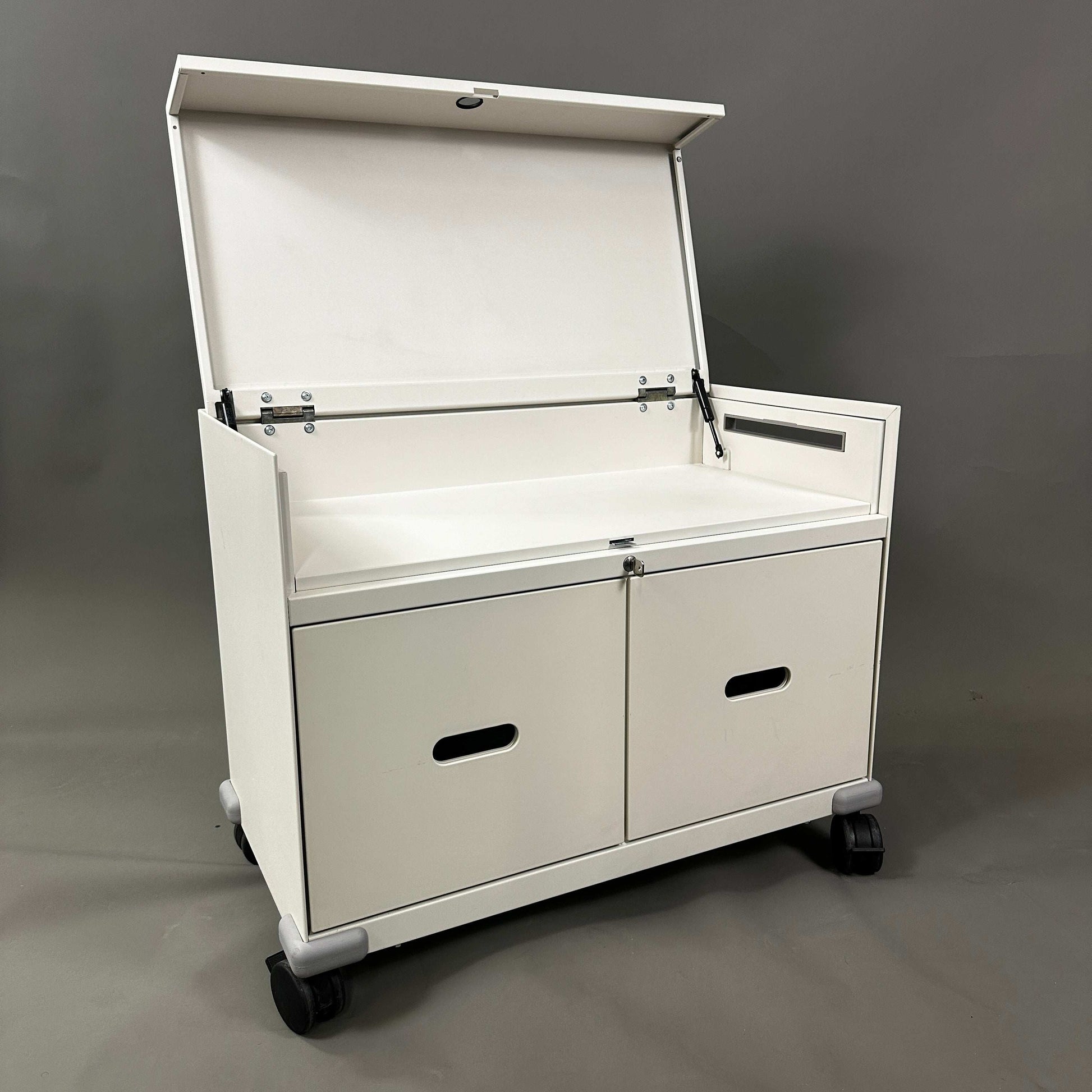 White Vitra PickUp Container with top folding compartment, handle, cable management, and rolling wheels