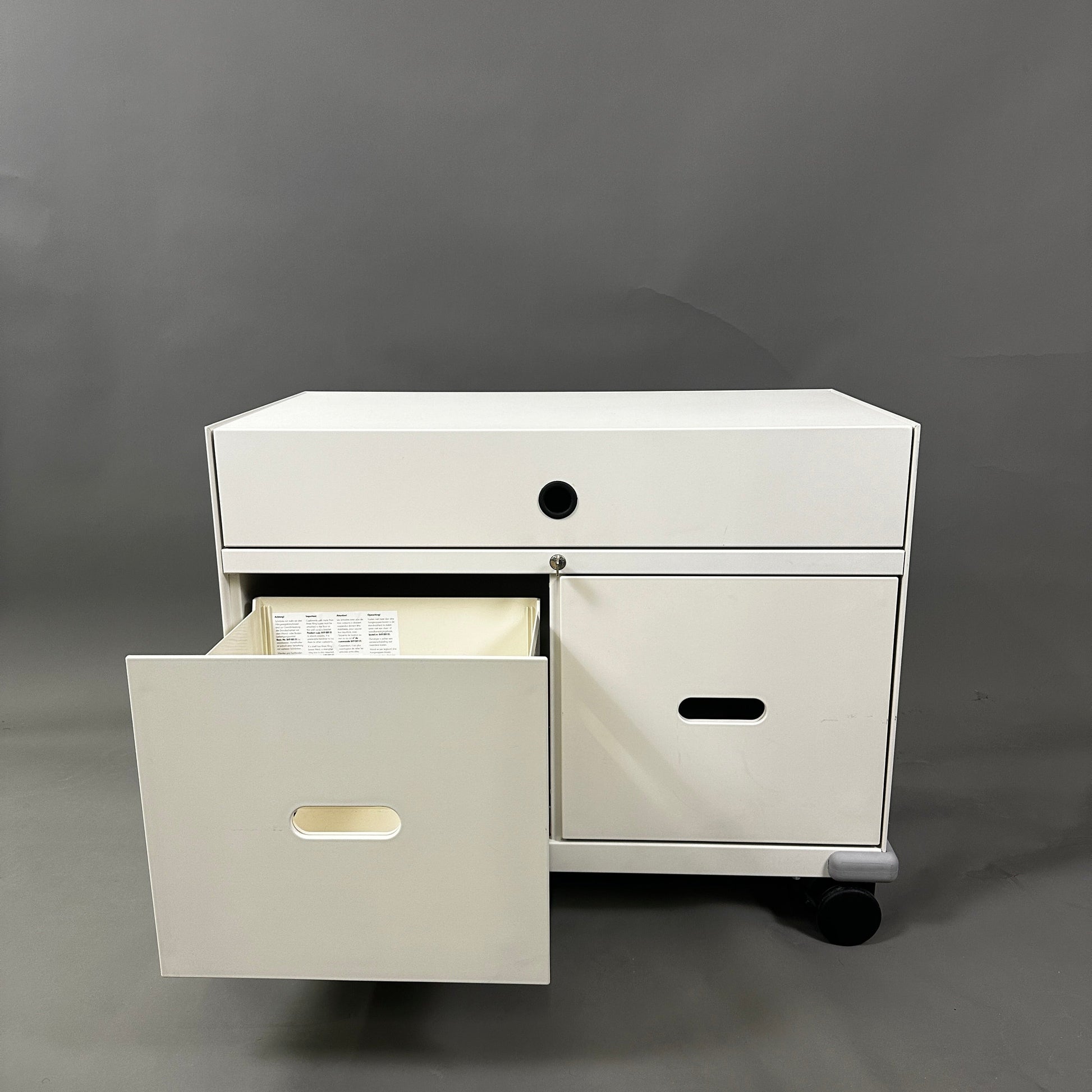 White Vitra PickUp Container with rolling wheels, open drawer, and cable management slot