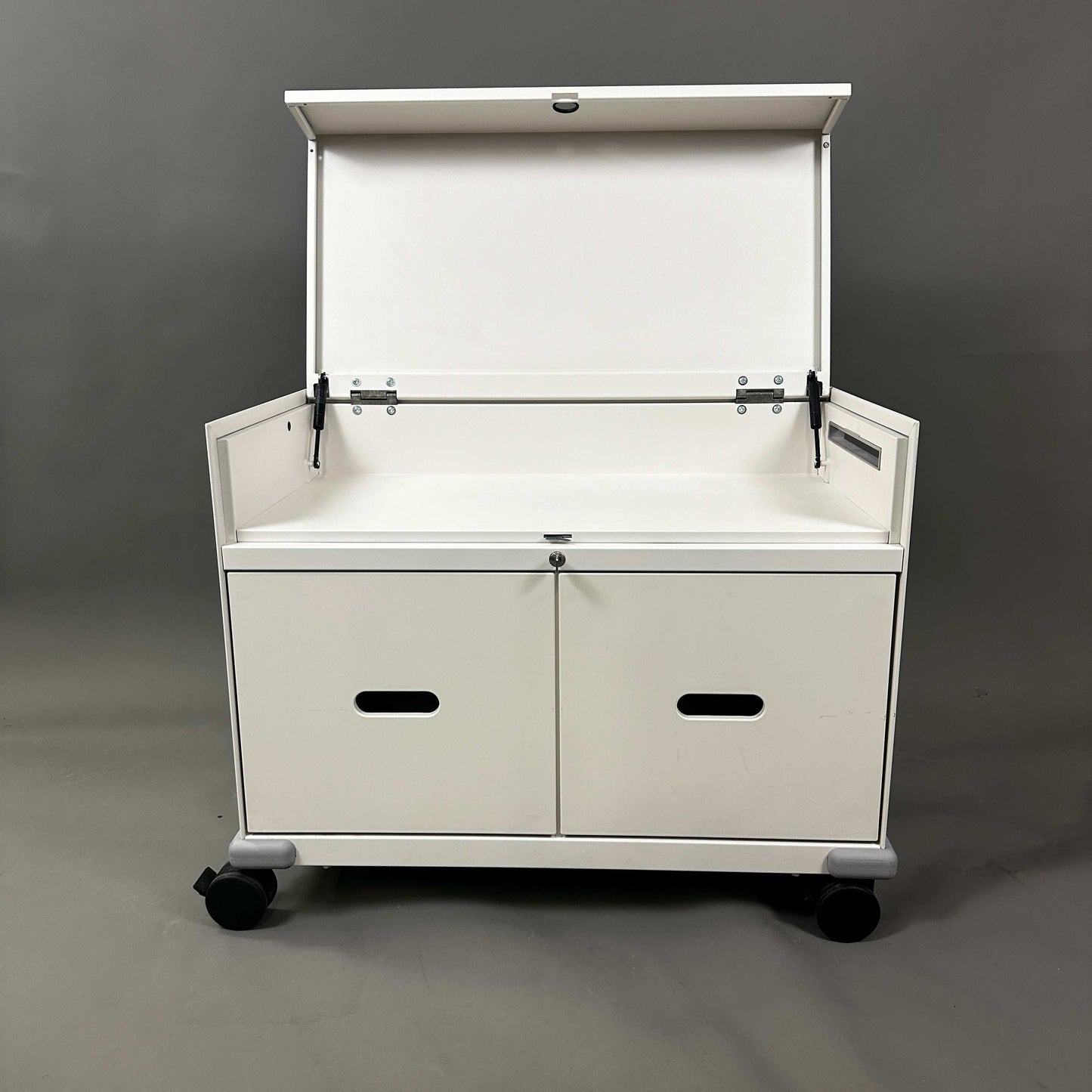 White Vitra PickUp Container with foldable top compartment, handles, cable management, and caster wheels