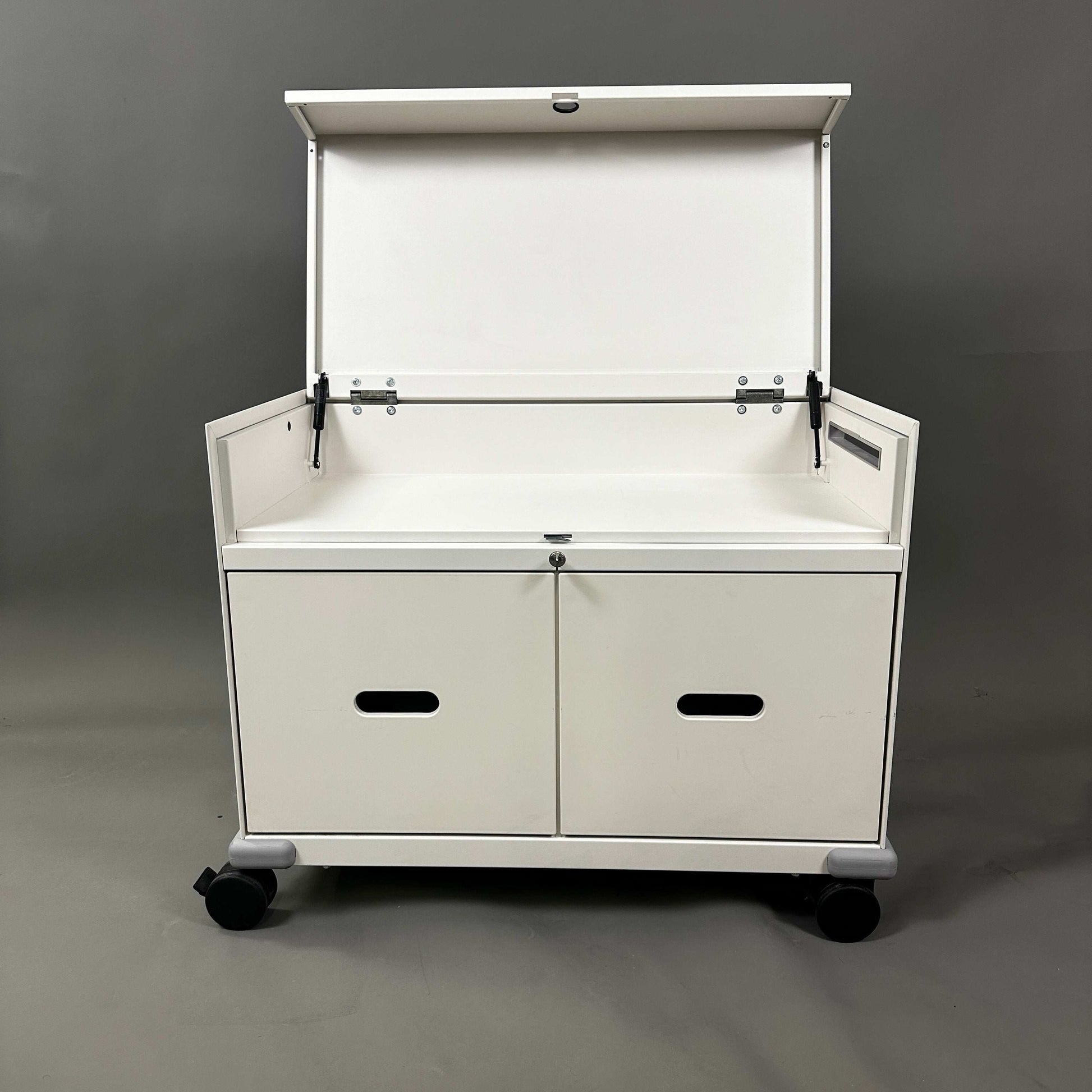 White Vitra PickUp Container with foldable top compartment, handles, cable management, and caster wheels