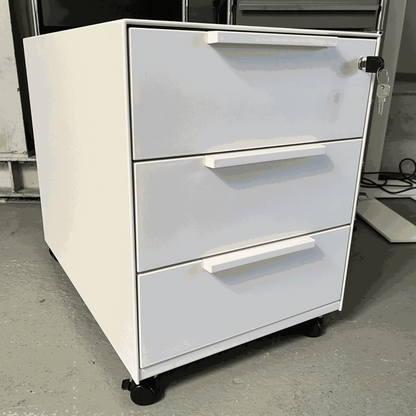 White Vitra Rollcontainer with metal body, plastic fronts, three drawers, and wheels, measuring 42x54x61cm