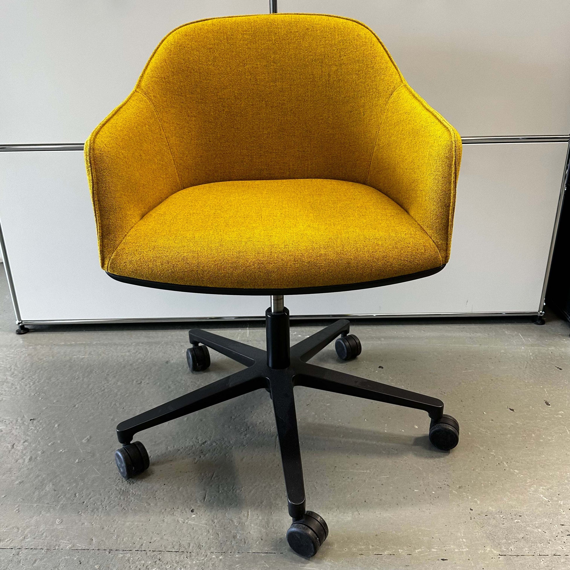Yellow Vitra Softshell Drehstuhl ergonomic office chair with five-star black base and caster wheels