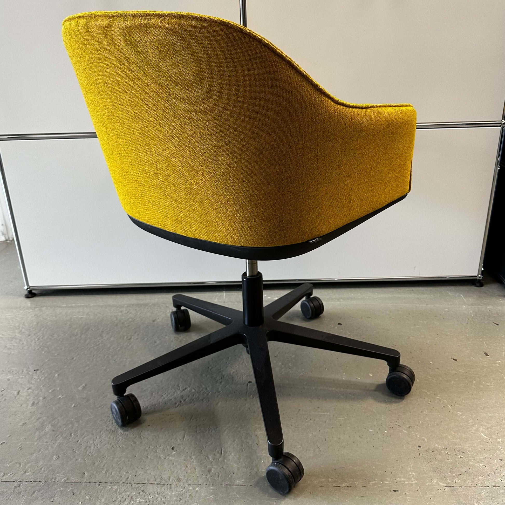 Yellow Vitra Softshell Drehstuhl office chair with five-star base and caster wheels