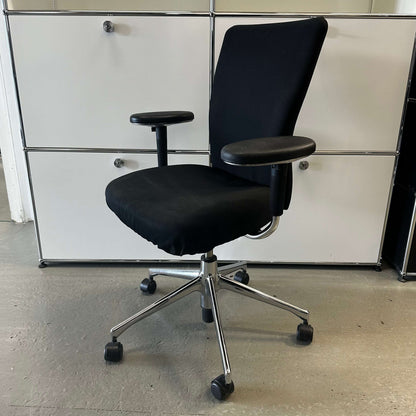 Black Vitra T-Chair office chair with adjustable armrests and metal base on wheels