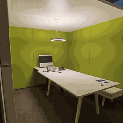 Vitra ThinkTank SilentWall team workspace with green fabric and perforated metal walls, white table, modern ceiling lamp, designed by Arik Levy.