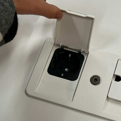 Close-up of a soft light Vitra Tyde Konferenztisch power outlet with cable management on the 200x100cm conference table surface