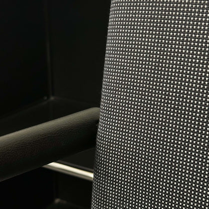 Close-up of black and grey textured fabric and armrest detail on Vitra Visasoft visitor chair