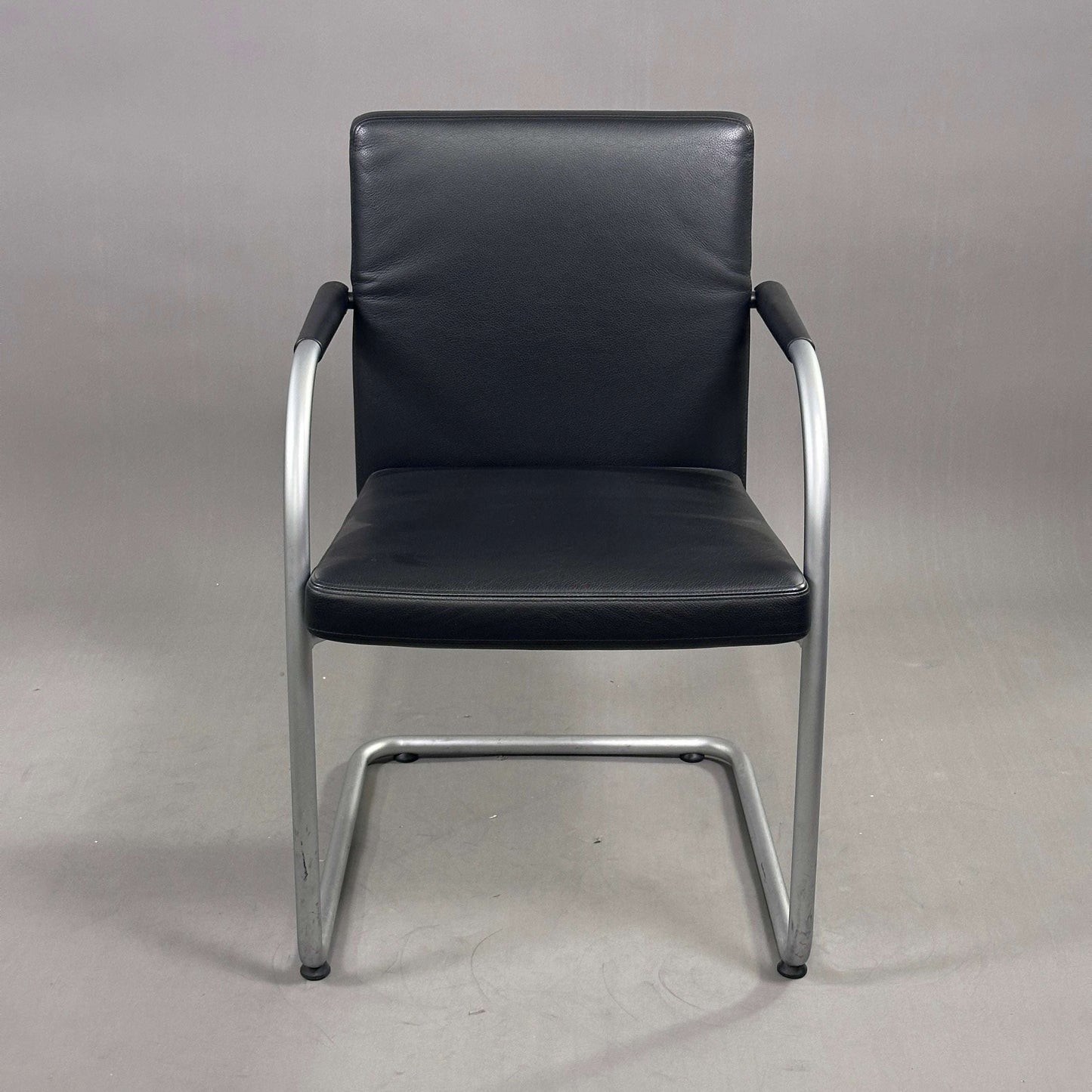 Vitra Visasoft chair with black leather upholstery and chrome frame