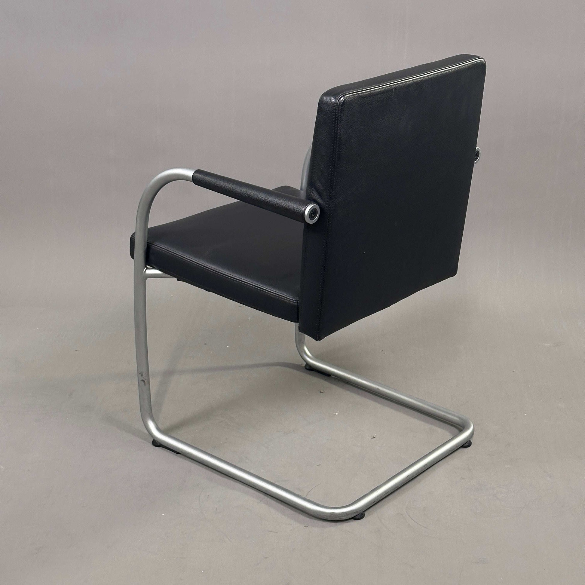 Black leather Vitra Visasoft chair with chrome cantilever frame and armrests