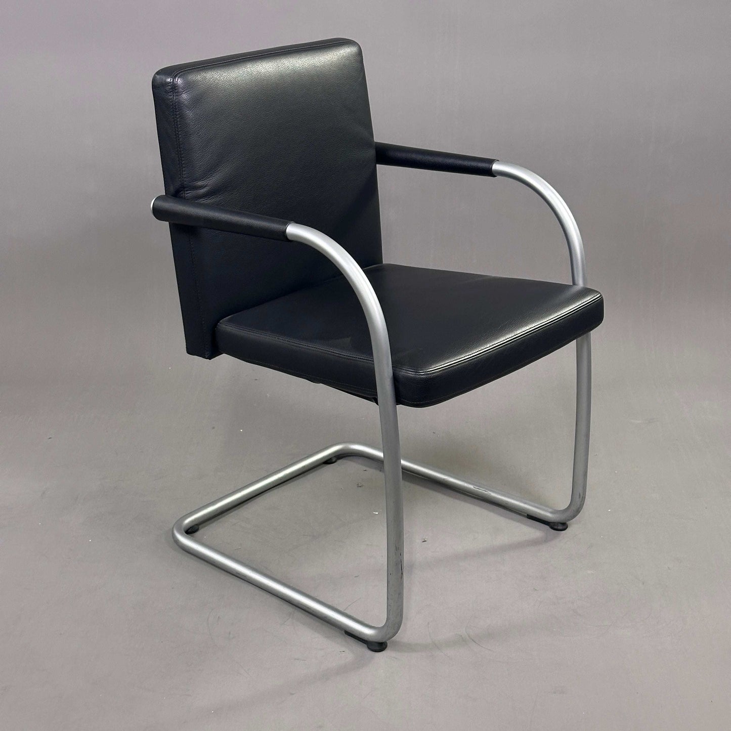 Vitra Visasoft chair with black leather upholstery and chrome cantilever frame