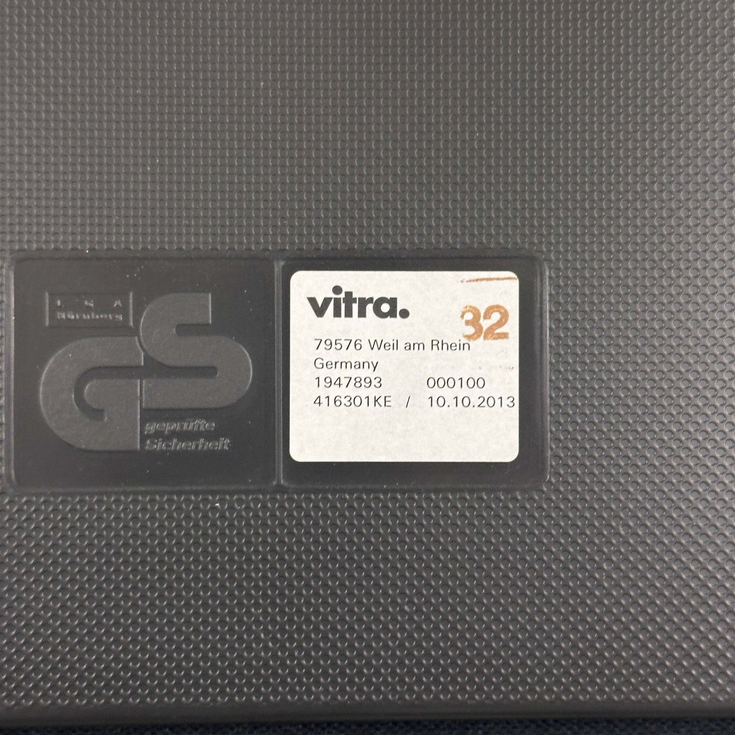 Vitra Visasoft black leather chair label with GS safety certification and manufacturing details