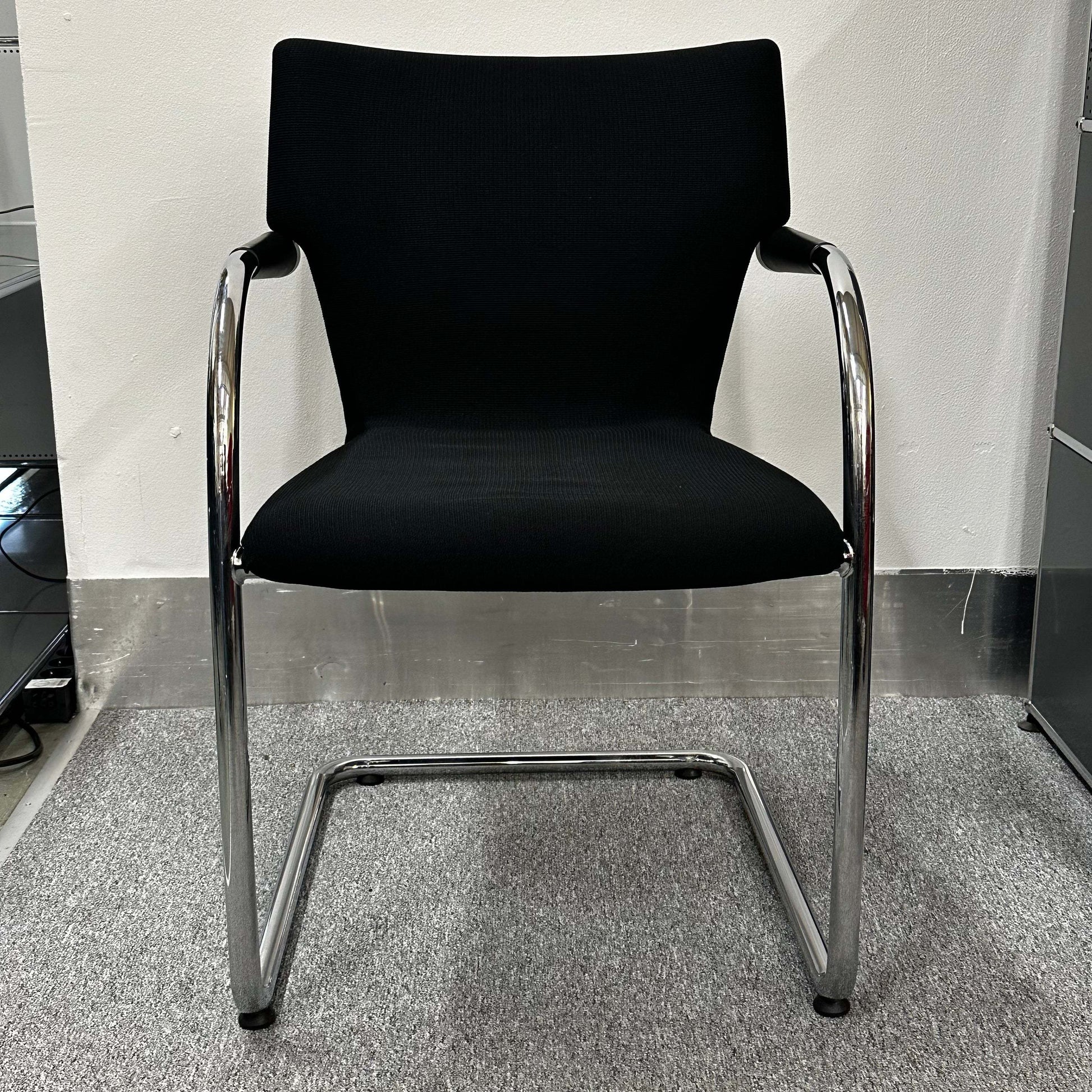 Black Vitra Visastripe conference chair with chrome cantilever frame and ergonomic design