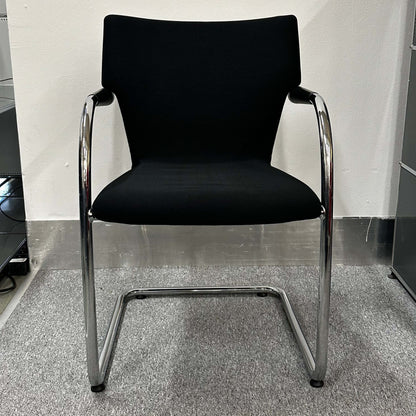 Black Vitra Visastripe conference chair with chrome cantilever frame and ergonomic design