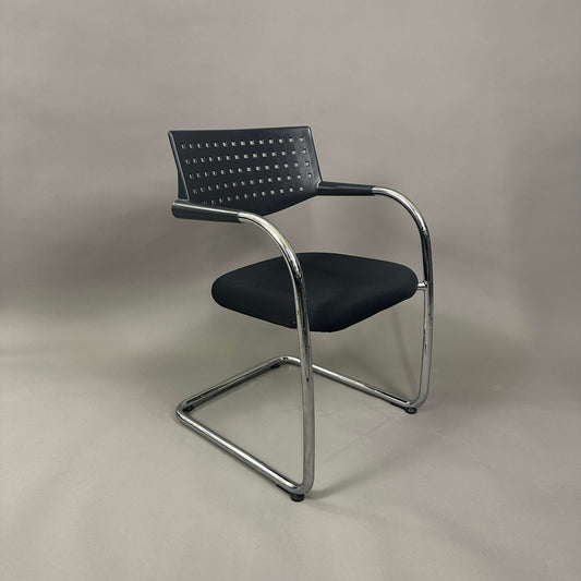 Vitra Visavis 1 black stackable chair with chrome frame and perforated backrest