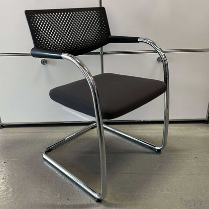 Vitra Visavis 2 chair with dark gray fabric seat, black plastic backrest, and chrome frame
