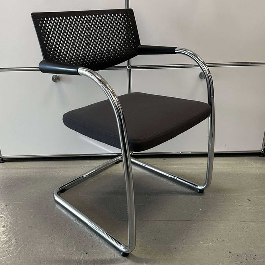 Vitra Visavis 2 chair with dark gray fabric seat, black plastic backrest, and chrome frame