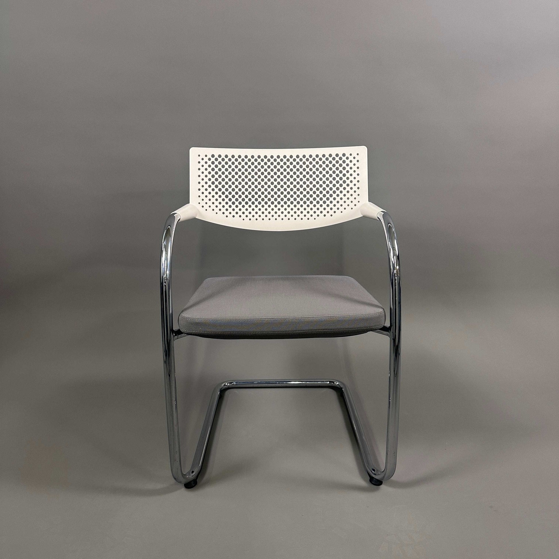 Vitra Visavis 2 chair with gray upholstered seat, white perforated plastic backrest, and chrome frame