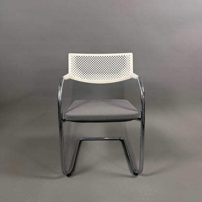 Vitra Visavis 2 chair with gray upholstered seat, white perforated plastic backrest, and chrome frame