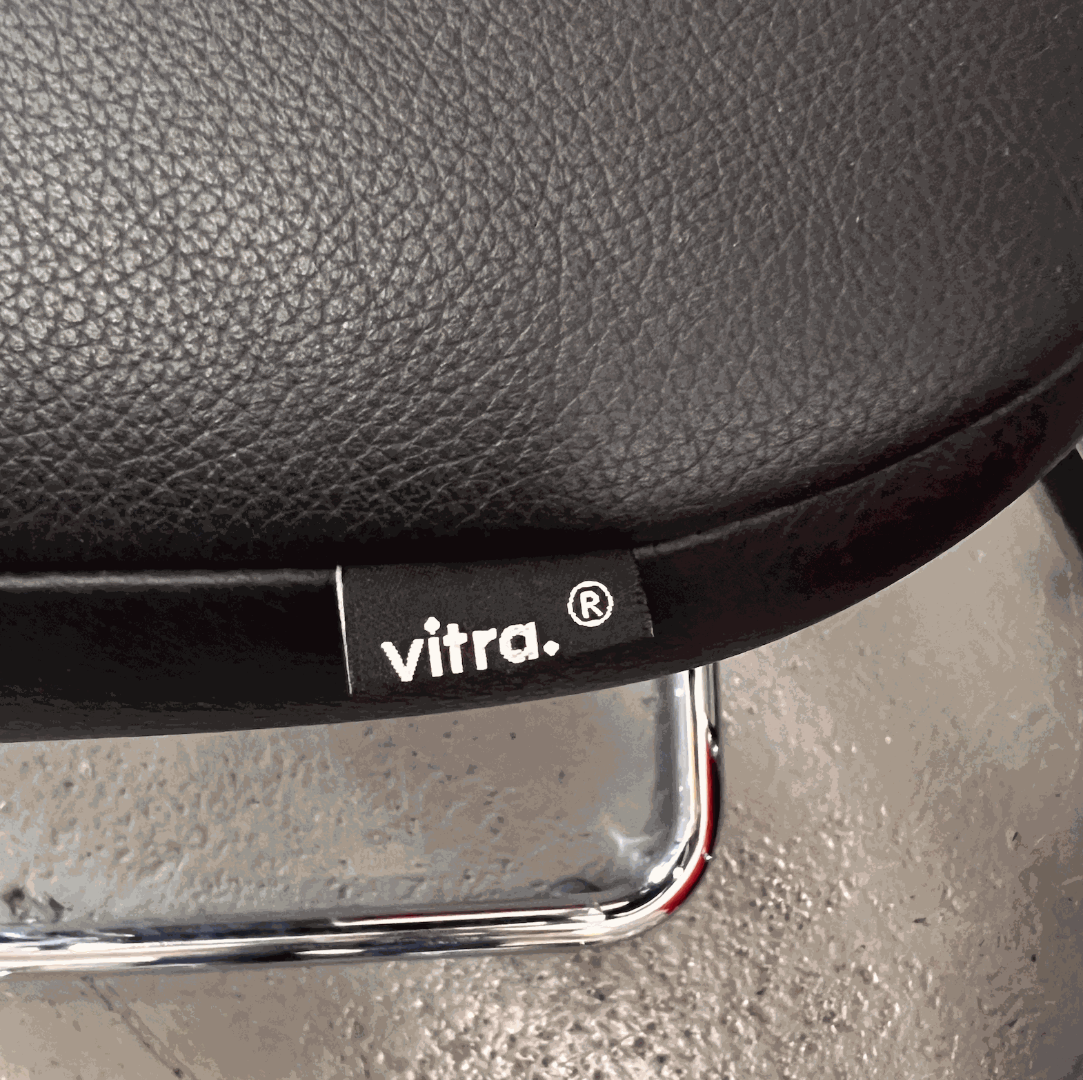 Vitra Visavis black softback leather chair with chrome frame close-up detail