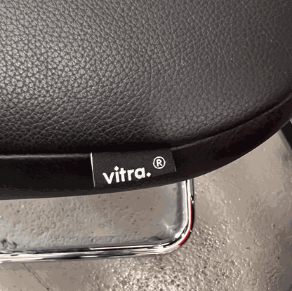 Vitra Visavis black softback leather chair with chrome frame close-up detail