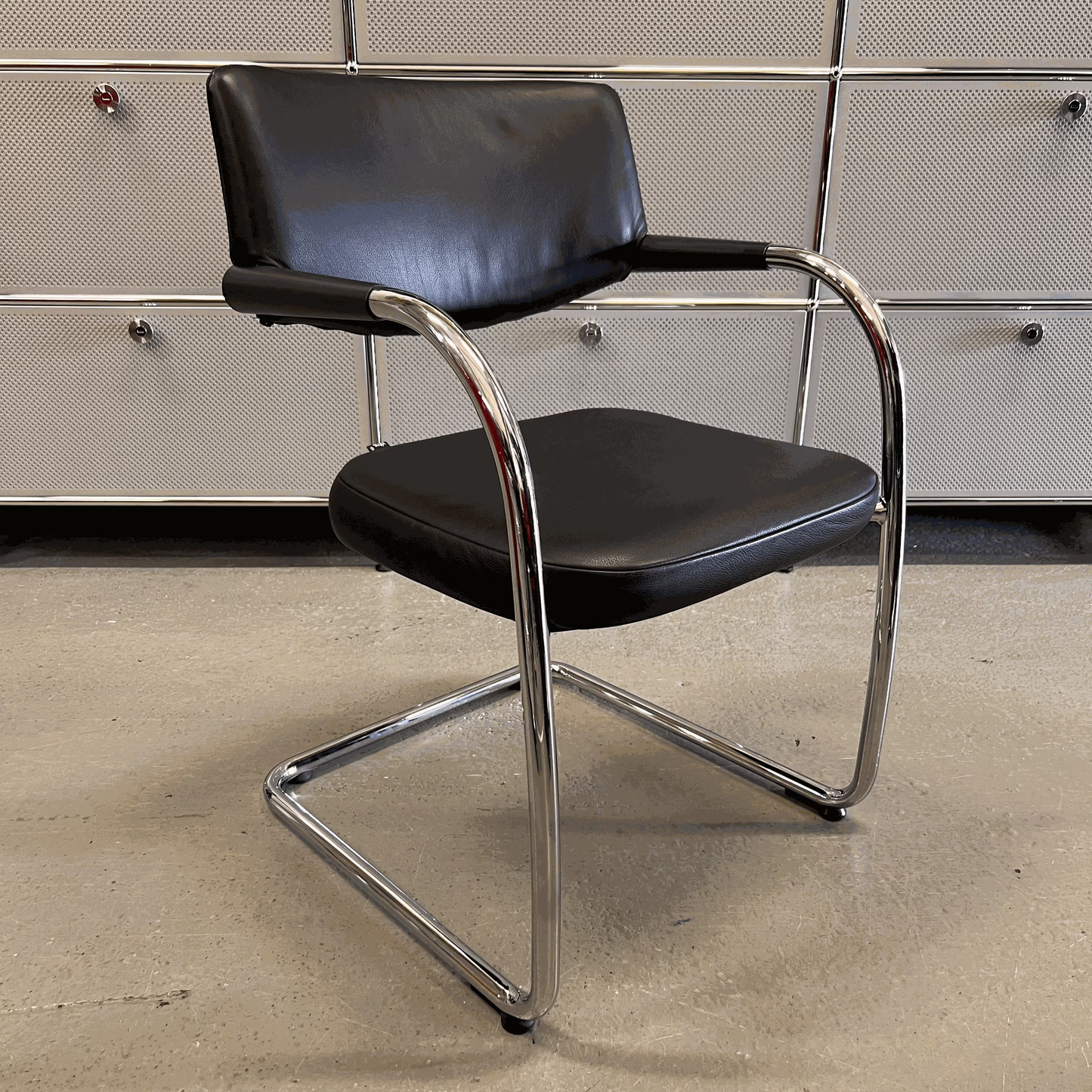 Vitra Visavis chair with black softback leather and chrome frame