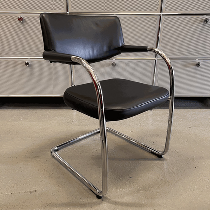 Vitra Visavis chair with black softback leather and chrome frame