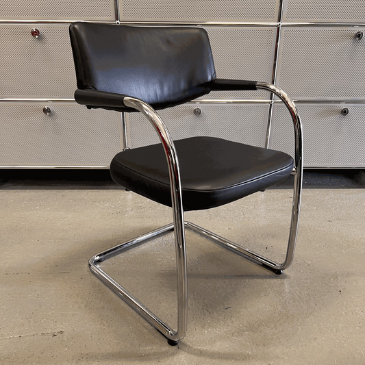 Vitra Visavis chair with black softback leather and chrome frame